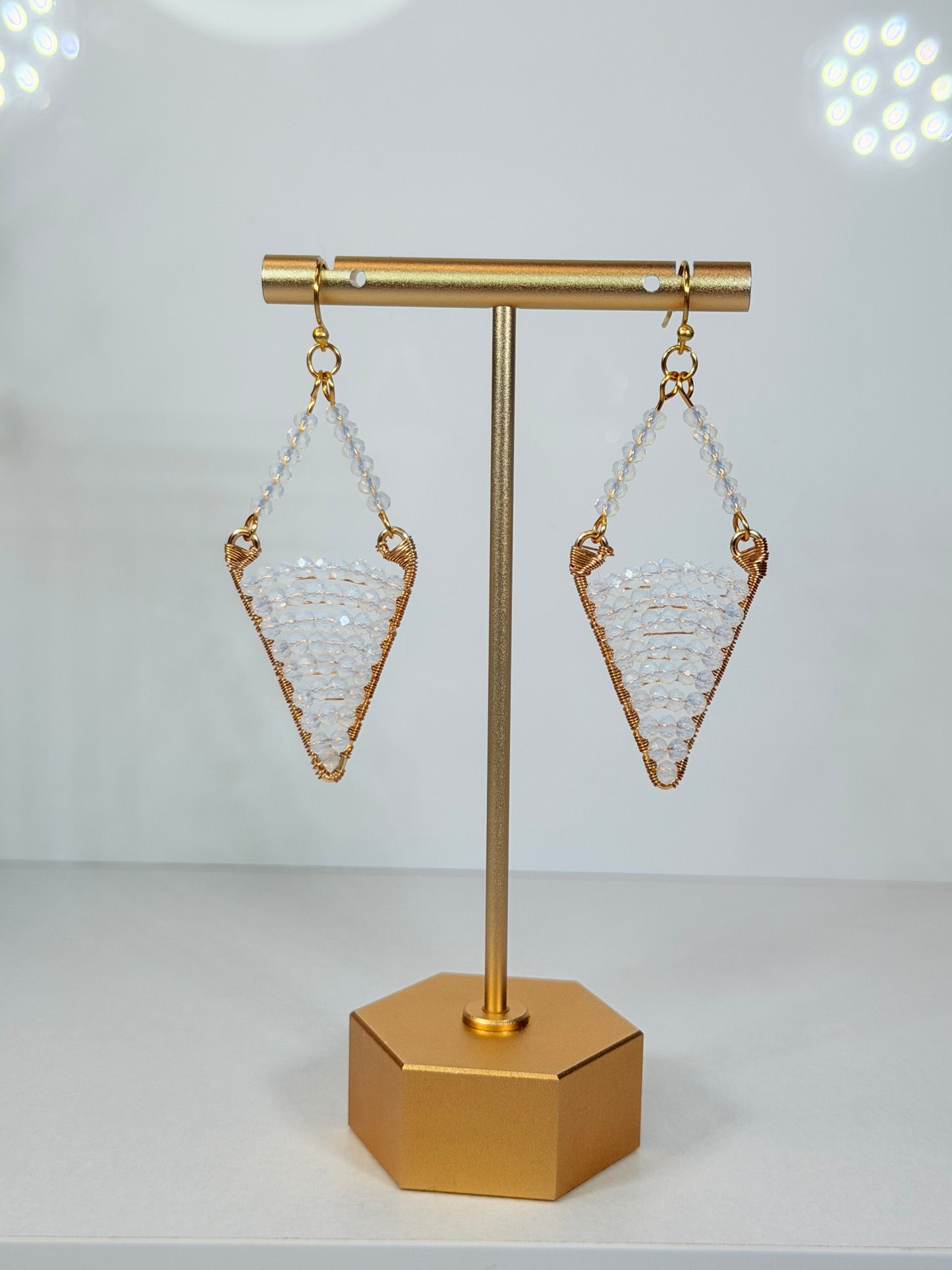 White Crystal Faceted Drop Diamond Shaped Earrings with unique design and Golden Accents
