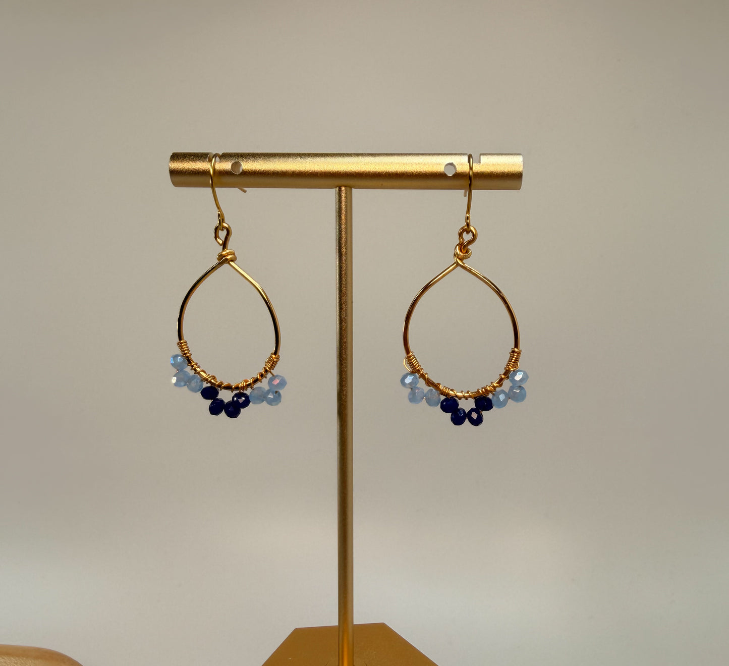 Light Gold Oval Shaped Blue Crystal accented earrings