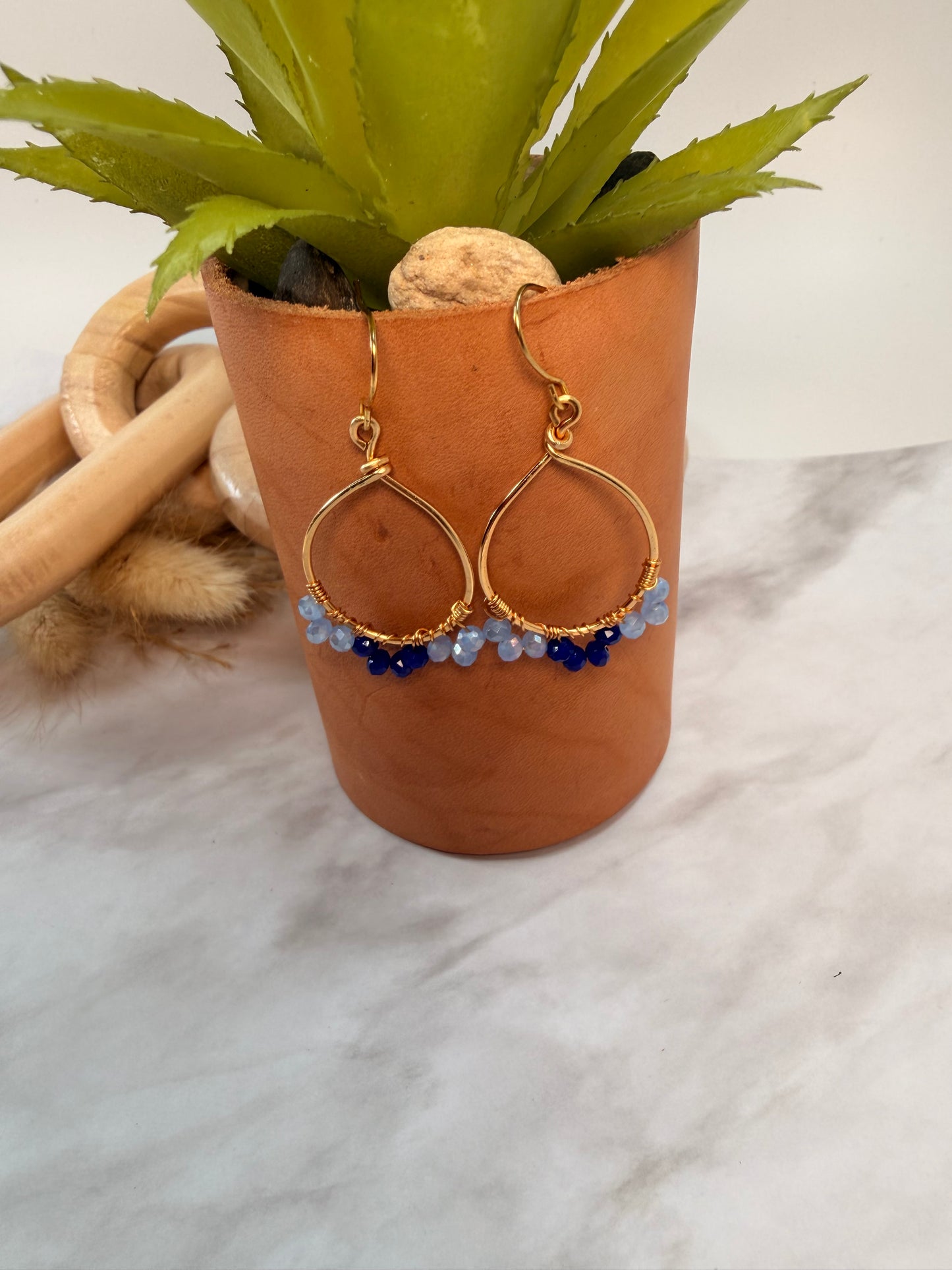 Light Gold Oval Shaped Blue Crystal accented earrings