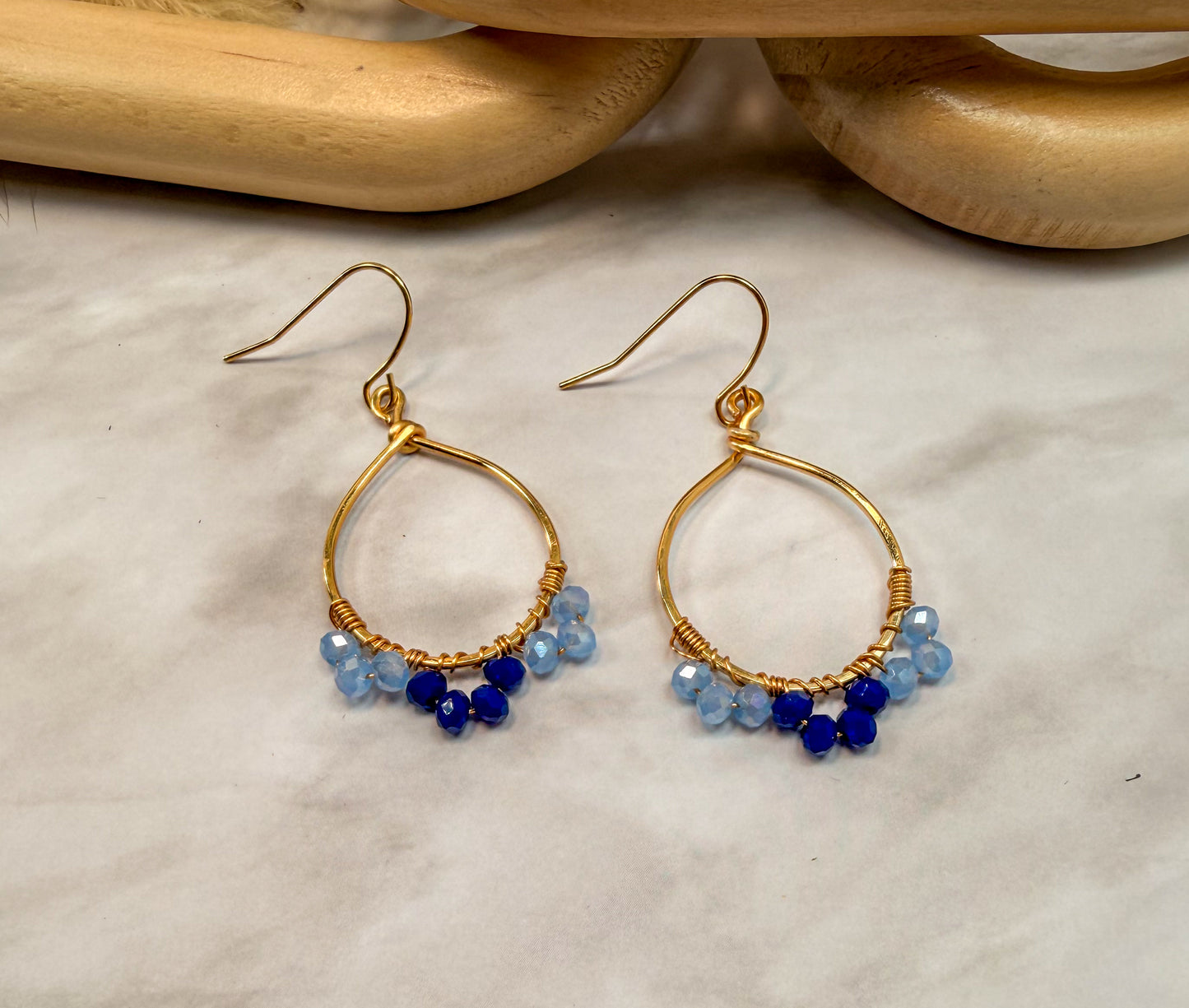 Light Gold Oval Shaped Blue Crystal accented earrings