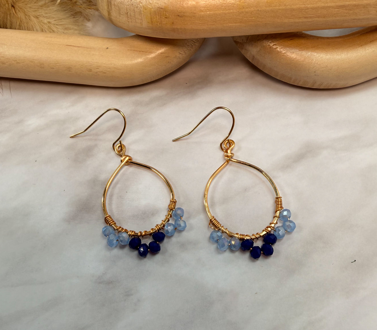Light Gold Oval Shaped Blue Crystal accented earrings
