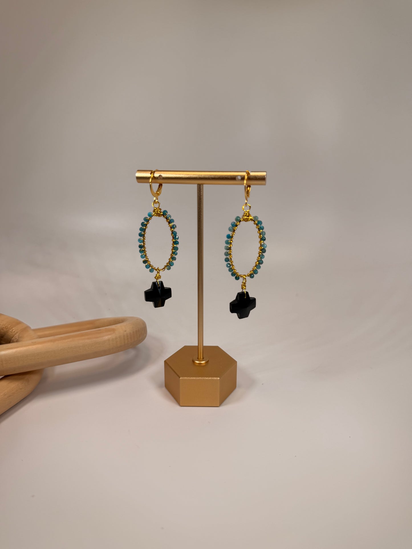 Golden Wire Wrapped Blue Jade Stones with Black Crystal Cross Accent Dangle Earrings
