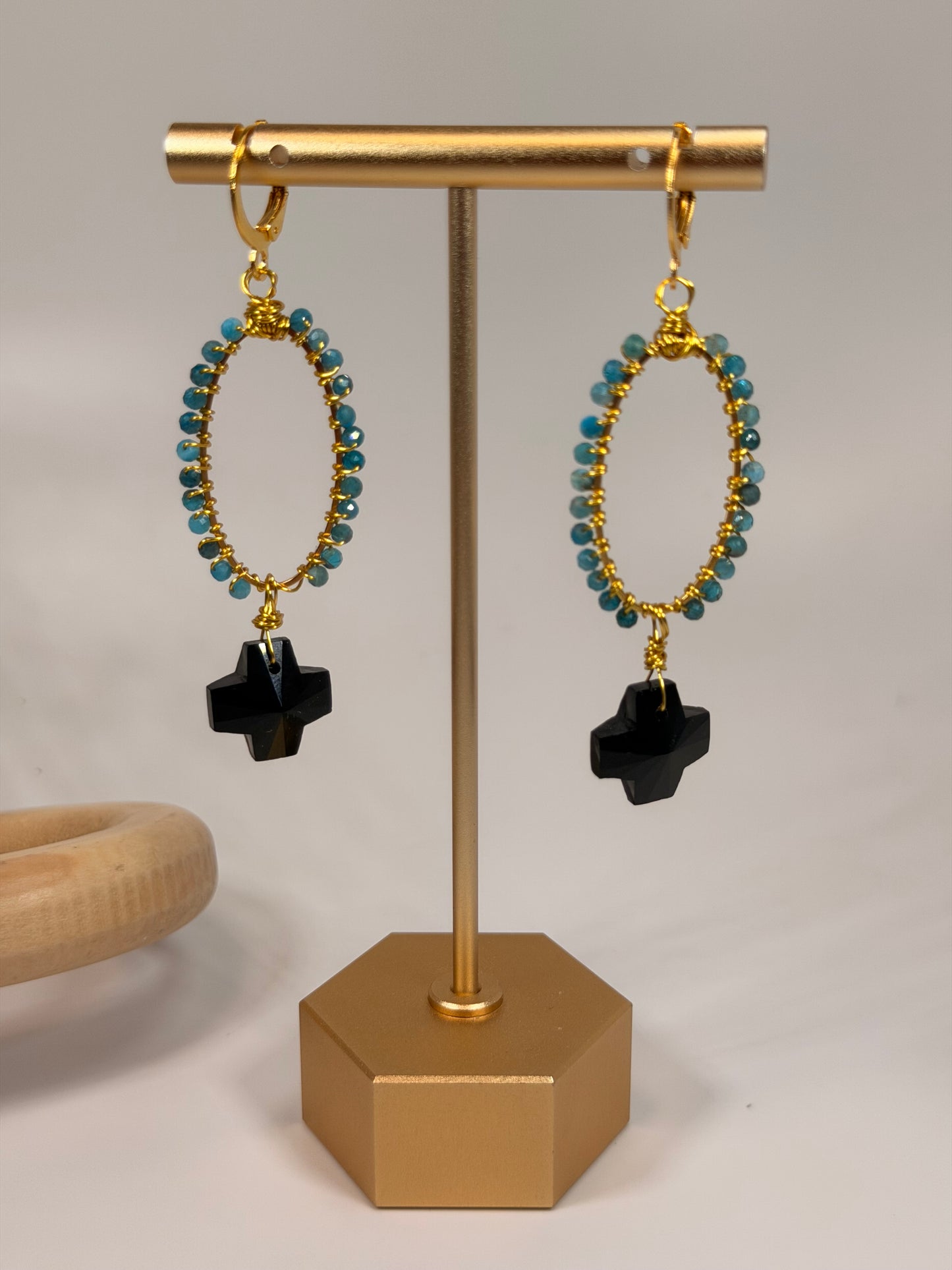 Golden Wire Wrapped Blue Jade Stones with Black Crystal Cross Accent Dangle Earrings
