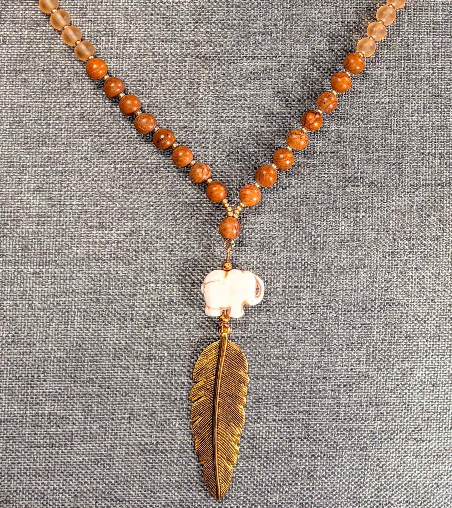 Hand Carved Stone Elephant Charm with Dark Gold Feather Pendant Long Necklace with Stone beads accents