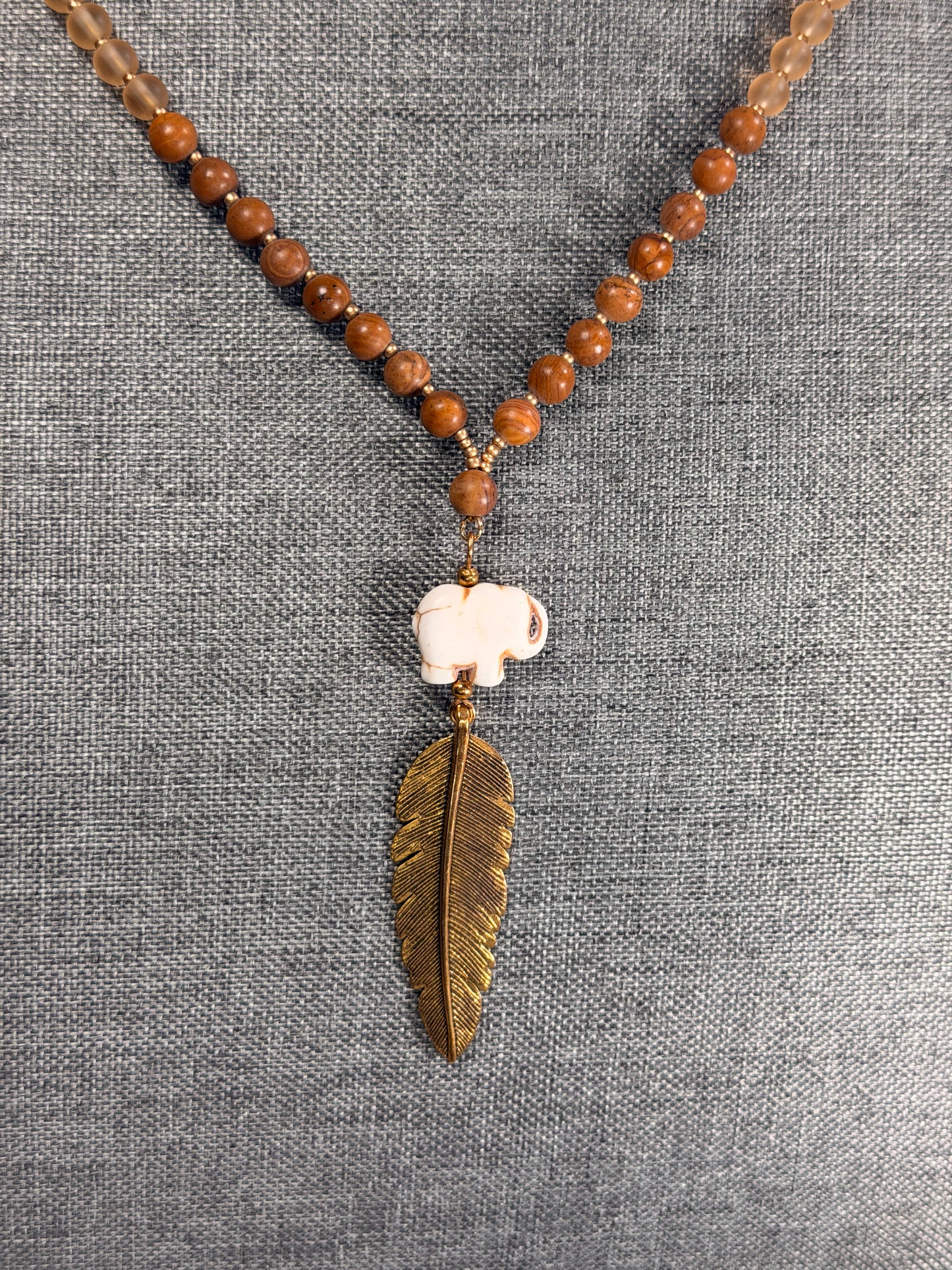 Hand Carved Stone Elephant Charm with Dark Gold Feather Pendant Long Necklace with Stone beads accents