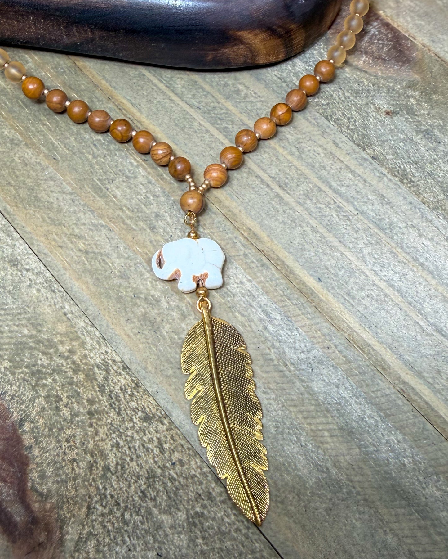 Hand Carved Stone Elephant Charm with Dark Gold Feather Pendant Long Necklace with Stone beads accents