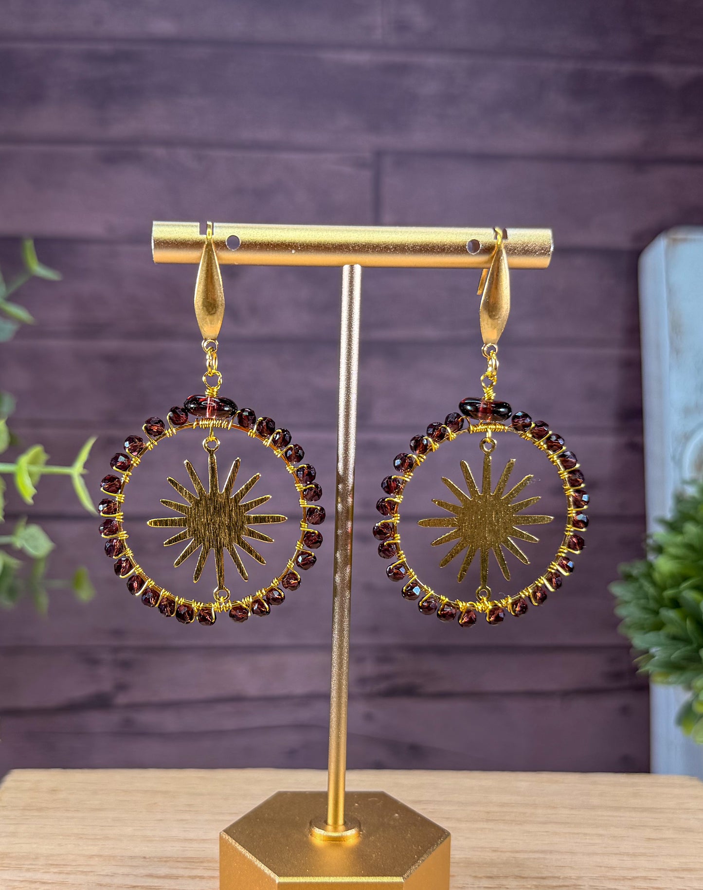 Crystal Faceted deep Lavender Crystals framing a golden sunburst Earrings