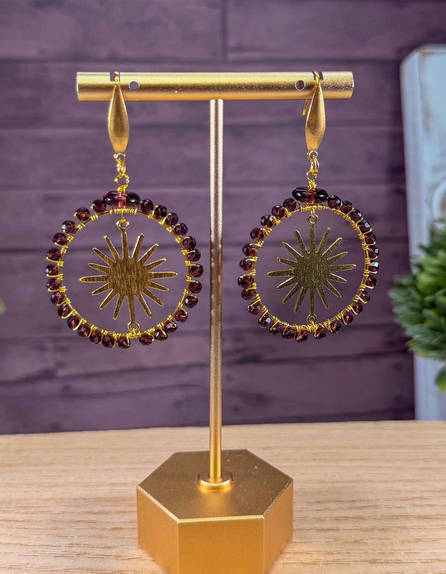 Crystal Faceted deep Lavender Crystals framing a golden sunburst Earrings