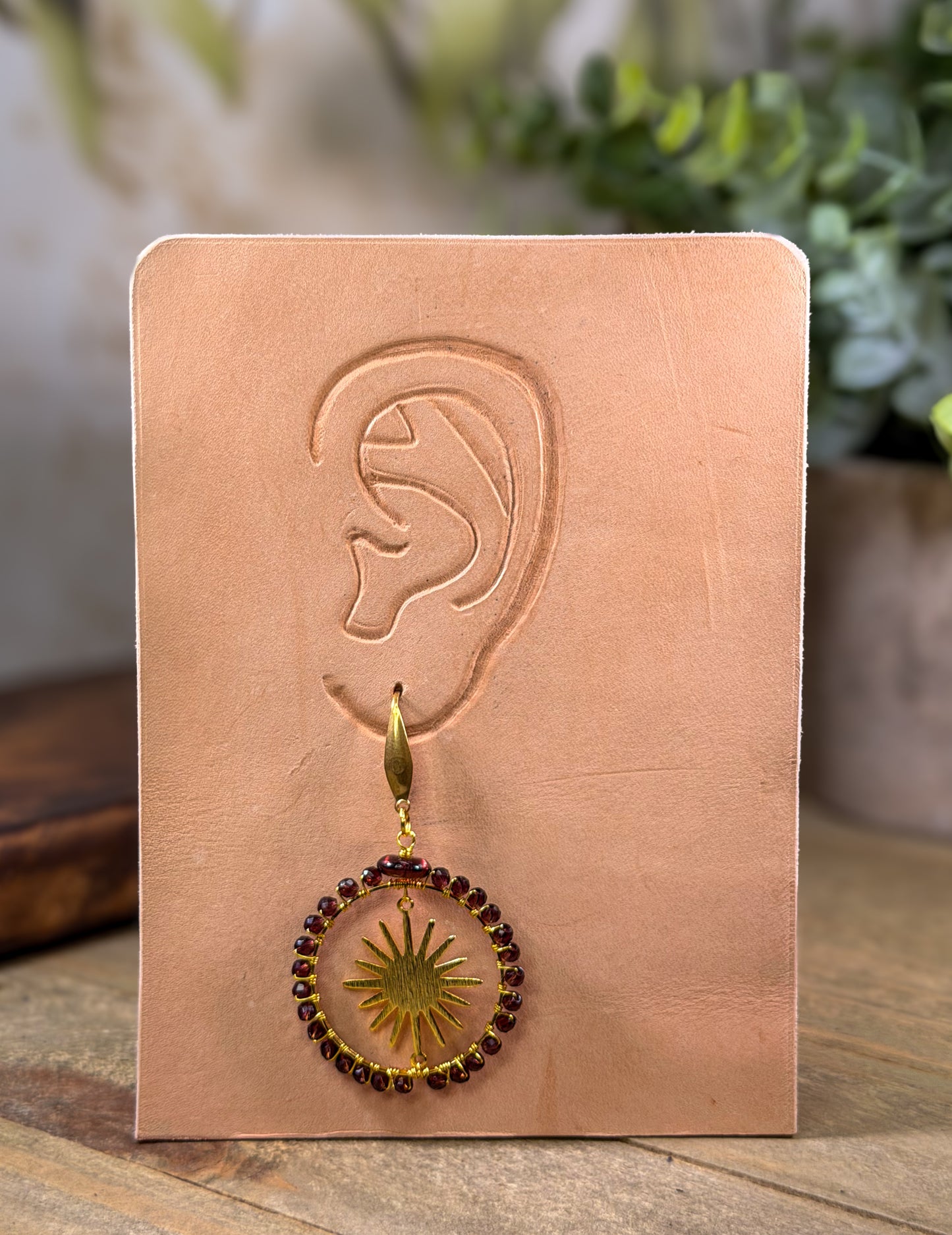 Crystal Faceted deep Lavender Crystals framing a golden sunburst Earrings