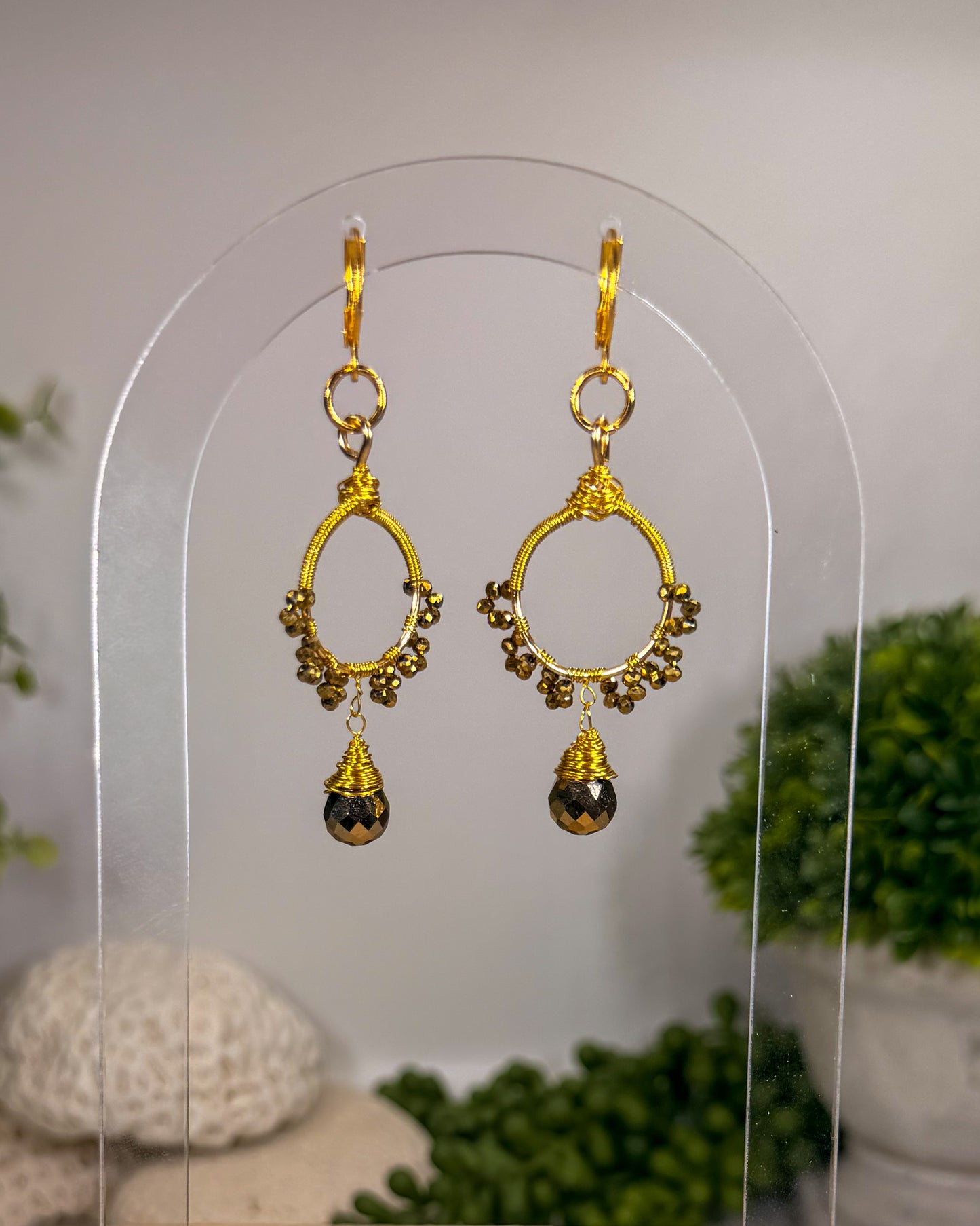 Gold sunburst hoop earrings with crystal tear drop wire wrapped charm with huggie closure and gold crystal beads