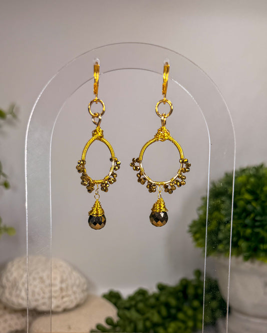 Gold sunburst hoop earrings with crystal tear drop wire wrapped charm with huggie closure and gold crystal beads