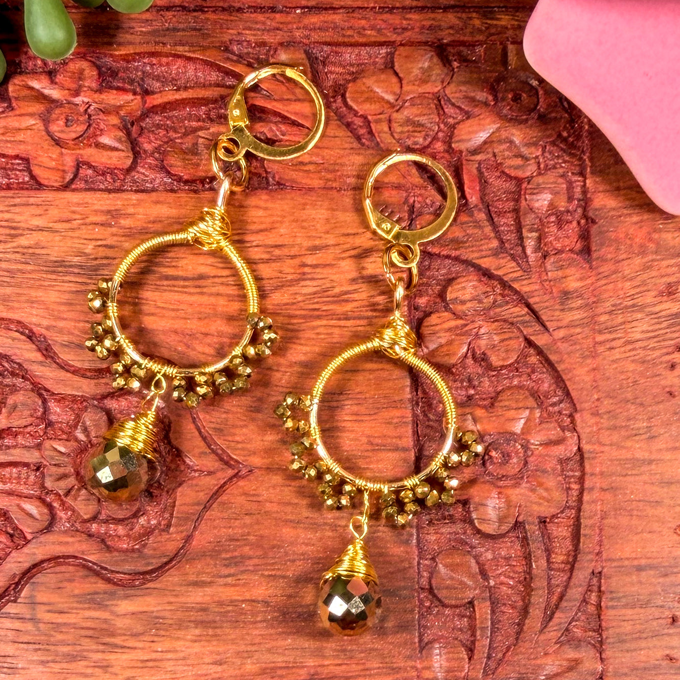 Gold sunburst hoop earrings with crystal tear drop wire wrapped charm with huggie closure and gold crystal beads